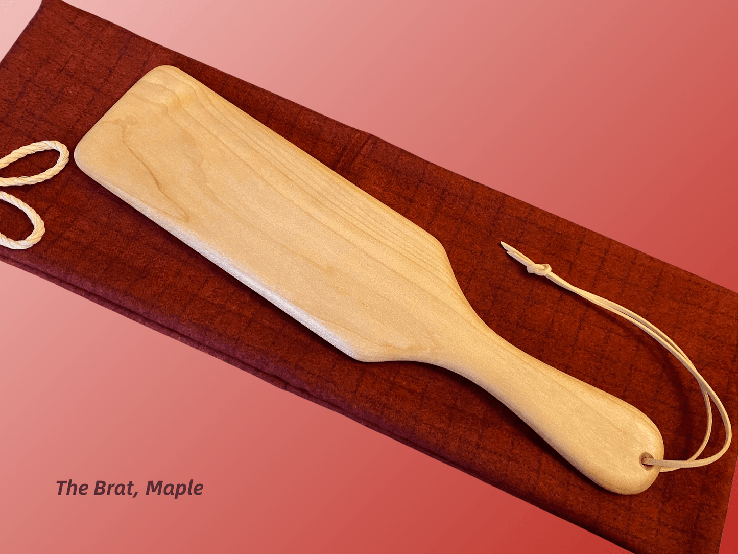 The Brat is a half-size frat paddle by LRS Toys - great for OTK spanking and all spanking positions