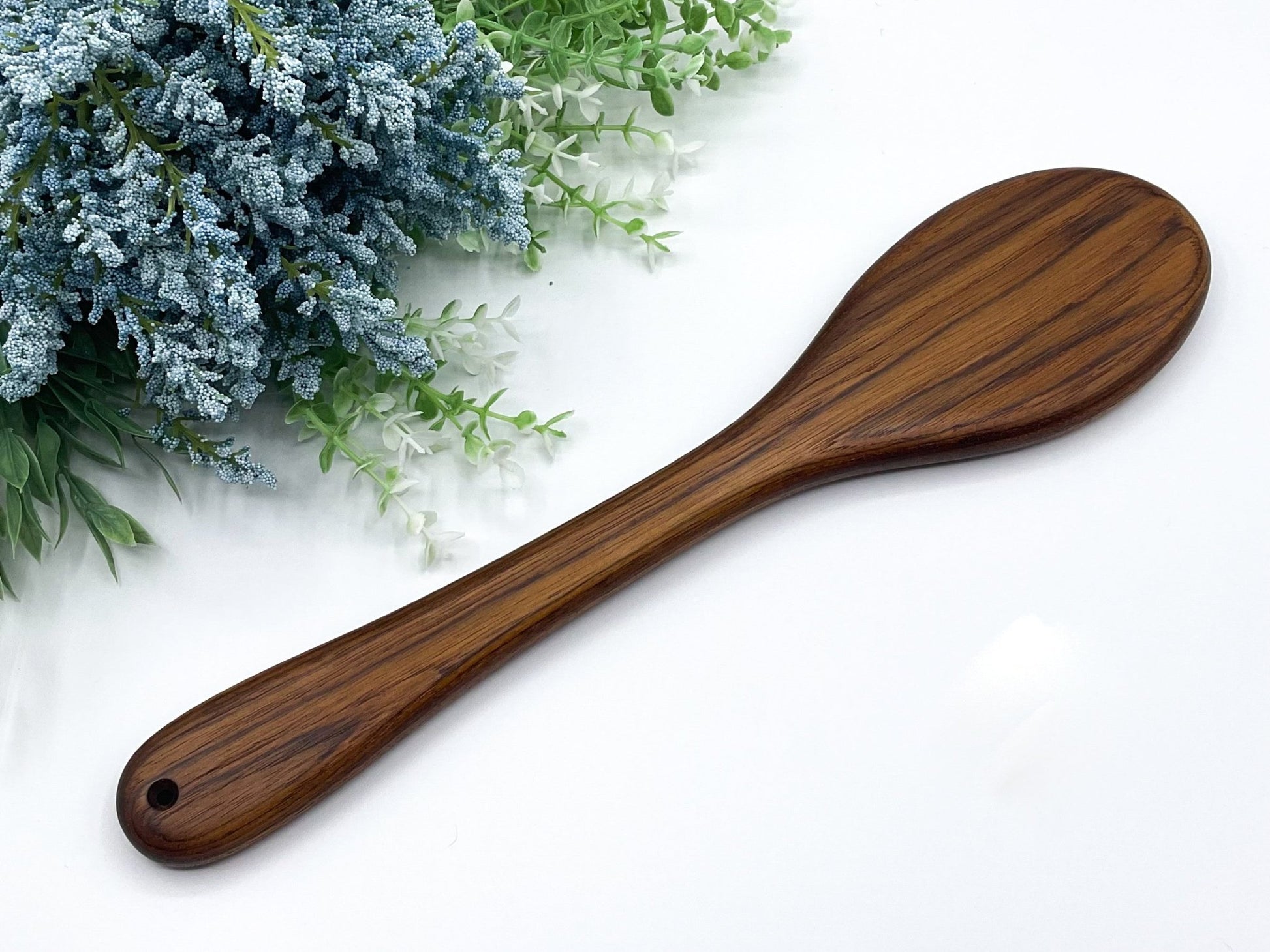 This spanking paddle by LRS Toys is made from genuine teak and will be a unique addition to any spanking toy collection