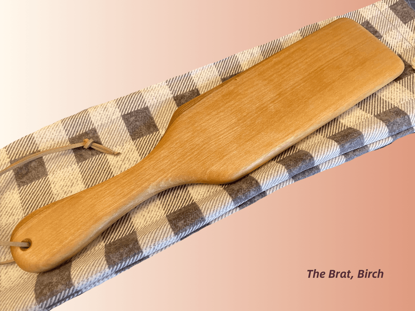 The Brat is a half-size frat paddle by LRS Toys - great for OTK spanking and all spanking positions