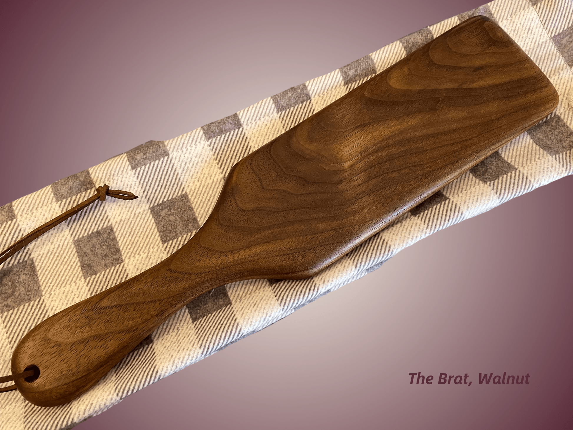 The Brat is a half-size frat paddle by LRS Toys - great for OTK spanking and all spanking positions