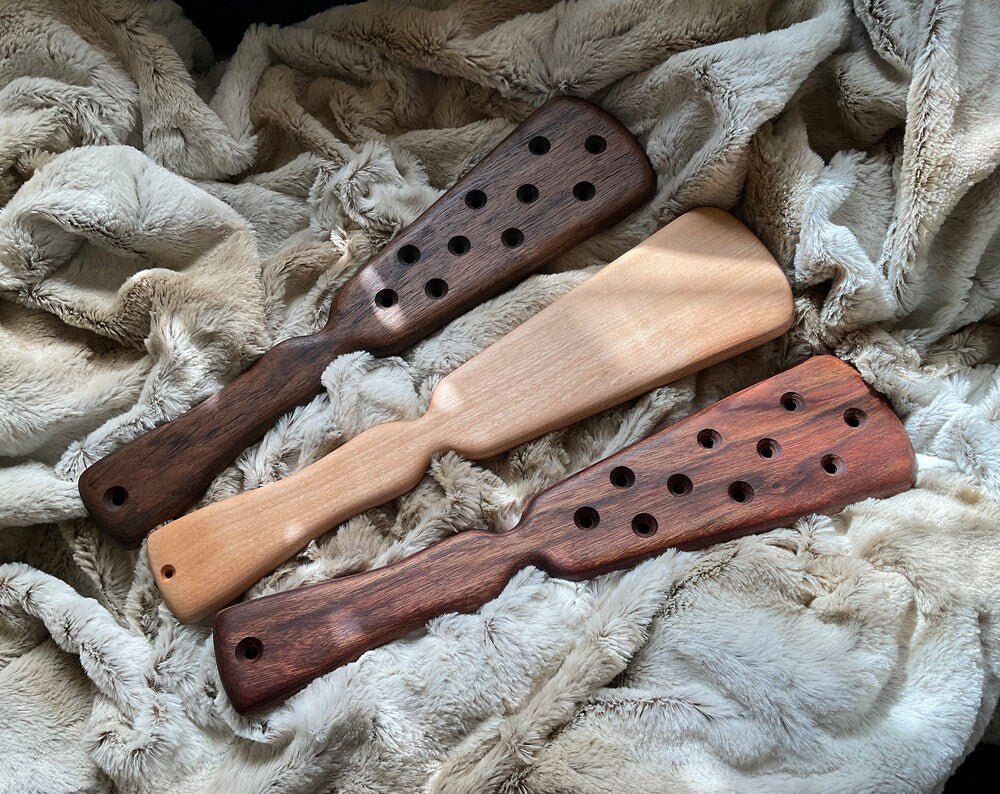 The Edwardian spanking paddle pictured in Tropical Walnut, Birch, and Caribbean Rosewood