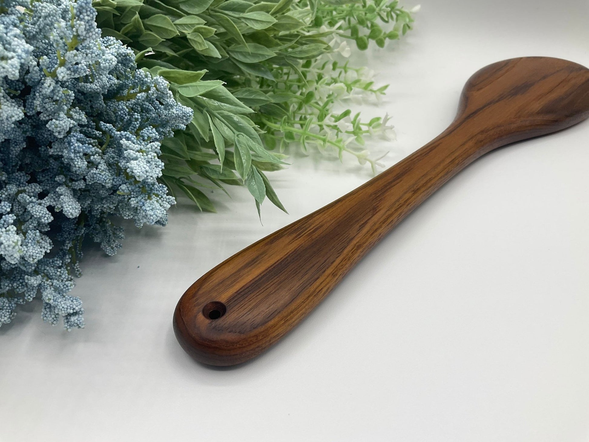 Genuine Arican Teak Spa-Inspired Spanking Paddle pictured to show smooth curve of handle